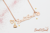Rose gold 'Soul2Soul' necklace with heart charms on a white background